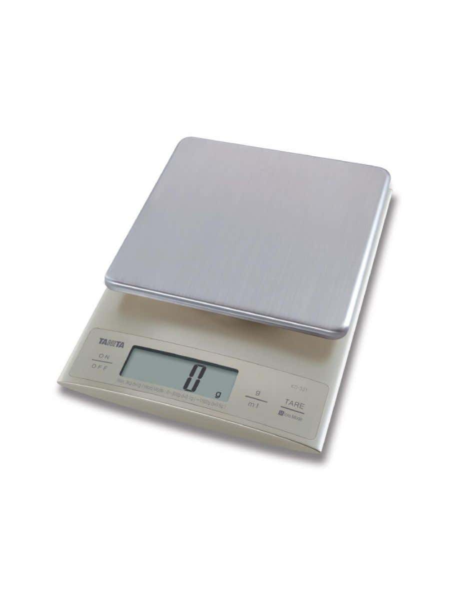 The electronic scale tare button - Stock Image - C035/9339